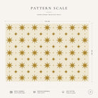 Pattern scale of the Stars Christmas tablecloth in ivory and gold across its 144 cm width, with care notes