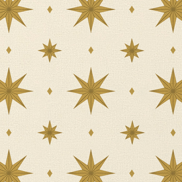 Close-up of the Stars Christmas tablecloth print in ivory and gold on cotton, showing gold eight-pointed stars
