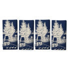 Village Toile Christmas napkins in ivory on navy, set of four, folded on white, showing the same fir tree and snowy cottage