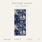 Pattern scale of the Village Toile Christmas table runner in ivory on navy across its 44 cm width, with care notes