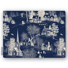 Village Toile Christmas tablecloth in ivory on navy, folded on white, showing a snowy village with a church and cottages