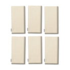 Plain ivory cotton Christmas napkins, set of six, folded on white