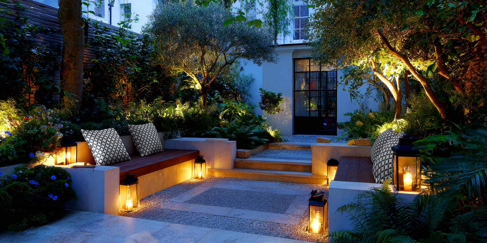 Izabela Peters - Waterproof outdoor garden cushions styled on a patio bench, handmade in the UK.
