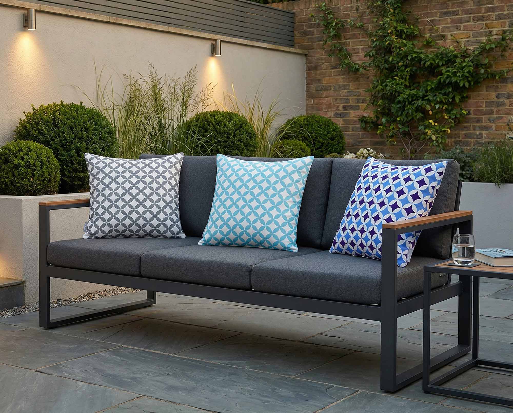 Outdoor Marrakech patterned cushions in grey and blue on a modern garden sofa