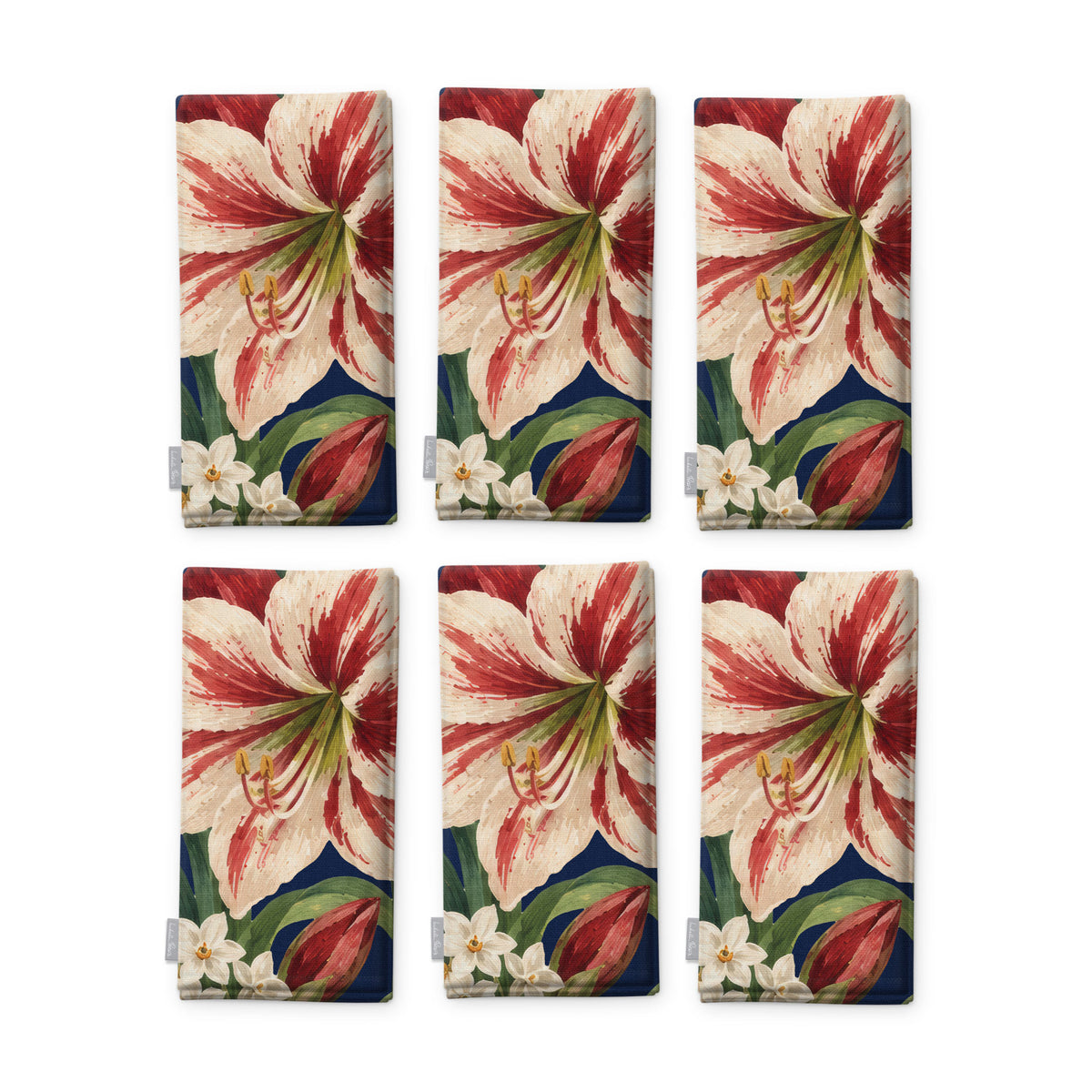 Navy Amaryllis Christmas napkins, set of six, folded on white, showing the same amaryllis flower