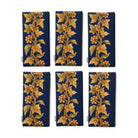Gilded Ivy Christmas napkins in navy and gold, set of six folded napkins showing the same trail of gold ivy and berries