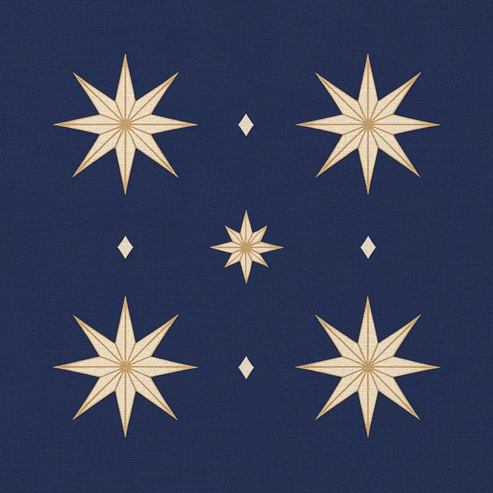 Close-up of the Stars Christmas napkin print in navy and gold on cotton, showing gold eight-pointed stars