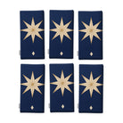 Stars Christmas napkins in navy and gold, set of six, folded on white, showing the same large gold eight-pointed star