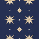 Close-up of the Stars Christmas table runner print in navy and gold on cotton, showing large gold eight-pointed stars