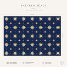 Pattern scale of the Stars Christmas tablecloth in navy and gold across its 144 cm width, with care notes