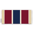 Signature Stripe Christmas table runner in navy, burgundy and gold, folded on white, showing broad stripes