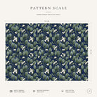 Pattern scale of the Mistletoe Christmas tablecloth in navy across its 144 cm width, with care notes