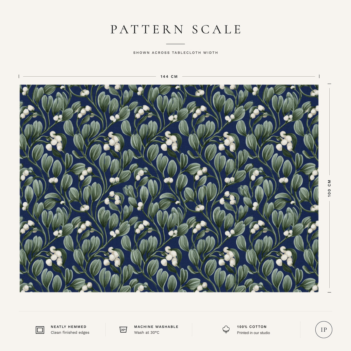 Pattern scale of the Mistletoe Christmas tablecloth in navy across its 144 cm width, with care notes