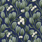 Close-up of the navy Mistletoe Christmas tablecloth print on cotton, showing sprigs of mistletoe with white berries