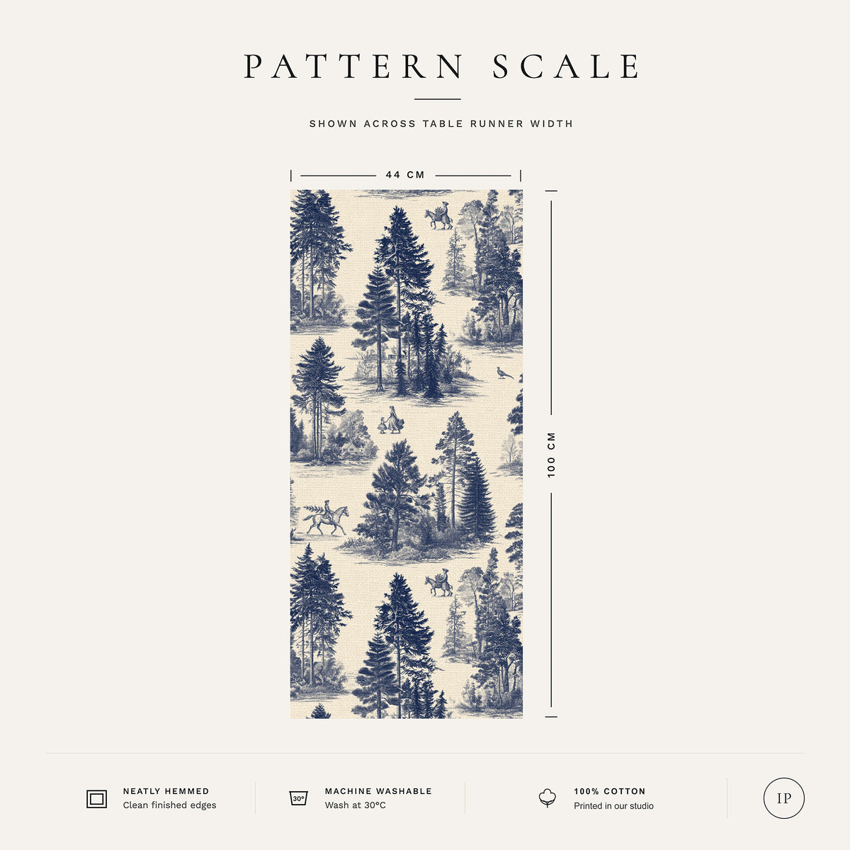 Pattern scale of the Fir Forest Toile Christmas table runner in navy on ivory across its 44 cm width, with care notes