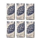 Pine Bough Christmas napkins in navy on ivory, set of six, folded on white, showing the same pine cone on a bough
