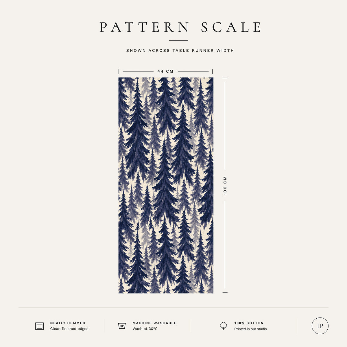 Pattern scale of the Spruce Stand Christmas table runner in navy on ivory across its 44 cm width, with care notes