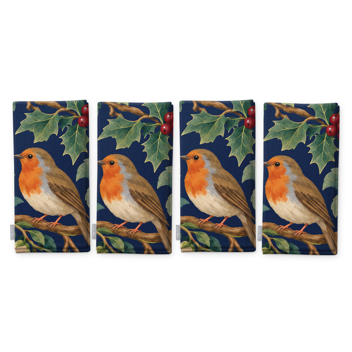 Navy Robins and Christmas Roses napkins, set of four, folded on white, showing the same robin under a sprig of holly