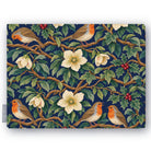 Navy Robins and Christmas Roses Christmas tablecloth folded on white, showing robins, Christmas roses and holly