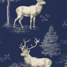 Close-up of the navy Stag Woodland Christmas table runner print on cotton, showing stags among woodland trees