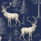 Close-up of the navy Stag Woodland Christmas tablecloth print on cotton, showing stags among woodland trees
