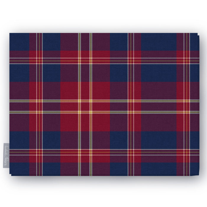 Navy tartan Christmas tablecloth folded on a white background, navy and burgundy with fine ivory and gold lines