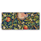 Navy Turtle Doves and Mistletoe Christmas table runner folded on white, showing a turtle dove among mistletoe and red apples