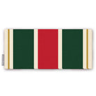 Signature Stripe Christmas table runner in red, green and burgundy, folded on white, showing broad stripes