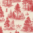 Close-up of the Fir Forest Toile Christmas tablecloth print in red on ivory cotton, showing fir trees and a rider