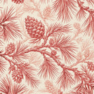 Close-up of the Pine Bough Christmas table runner print in red on ivory cotton, showing pine boughs and cones
