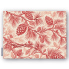 Pine Bough Christmas tablecloth in red on ivory, folded on white, showing pine boughs and cones