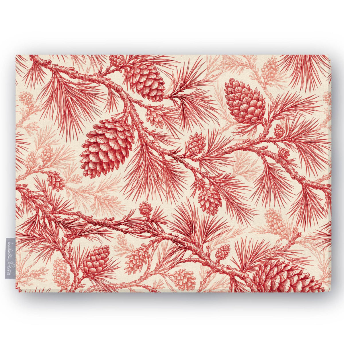 Pine Bough Christmas tablecloth in red on ivory, folded on white, showing pine boughs and cones