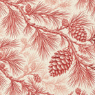 Close-up of the Pine Bough Christmas tablecloth print in red on ivory cotton, showing pine boughs and cones