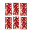 Spruce Stand Christmas napkins in red on ivory, set of six, folded on white, showing the same spruce trees