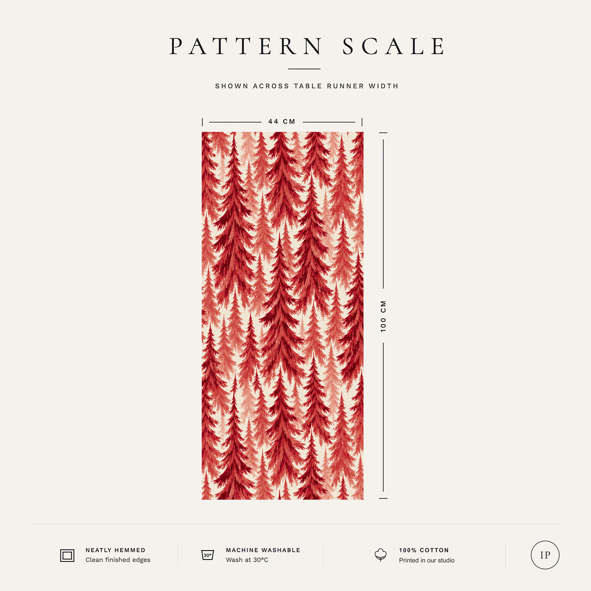 Pattern scale of the Spruce Stand Christmas table runner in red on ivory across its 44 cm width, with care notes