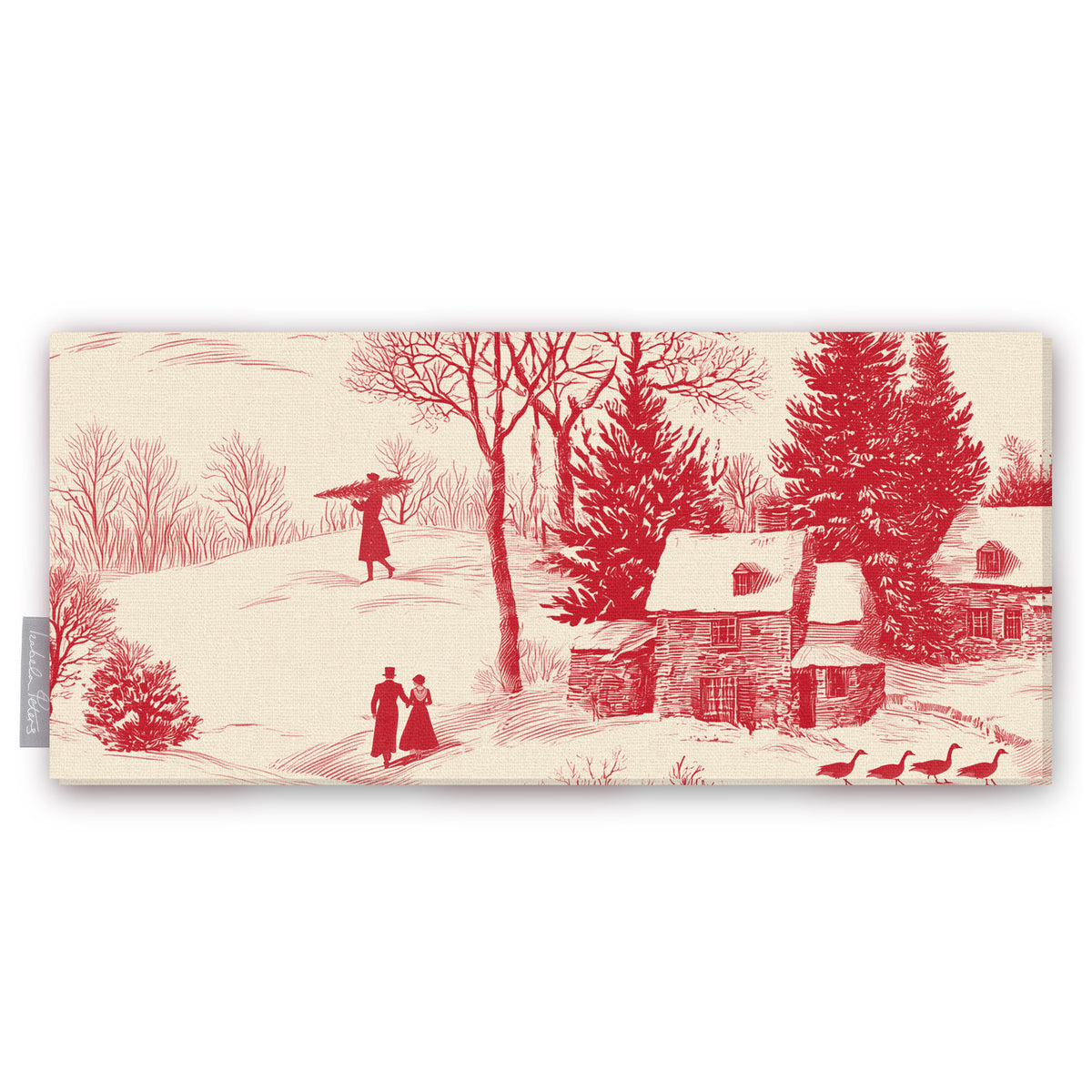 Village Toile Christmas table runner in red on ivory, folded on white, showing villagers and cottages in the snow