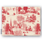 Village Toile Christmas tablecloth in red on ivory, folded on white, showing a snowy village with a church and cottages