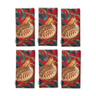 Red Partridge and Pear Christmas napkins, set of six, folded on white, showing the same partridge among pears