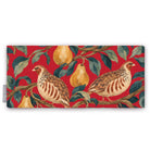 Red Partridge and Pear Christmas table runner folded on white, showing a partridge among pears and leaves