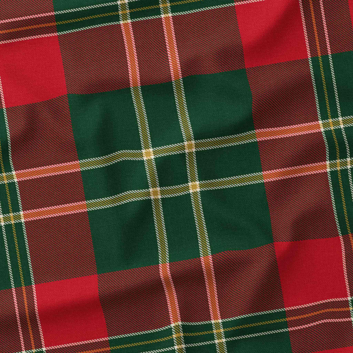 Close-up of the red tartan Christmas tablecloth, showing the red and deep green check and fine ivory and gold lines