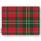 Red tartan Christmas tablecloth folded on a white background, red and deep green with fine ivory and gold lines