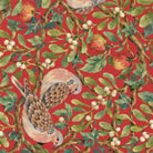 Close-up of the red Turtle Doves and Mistletoe Christmas table runner print on cotton