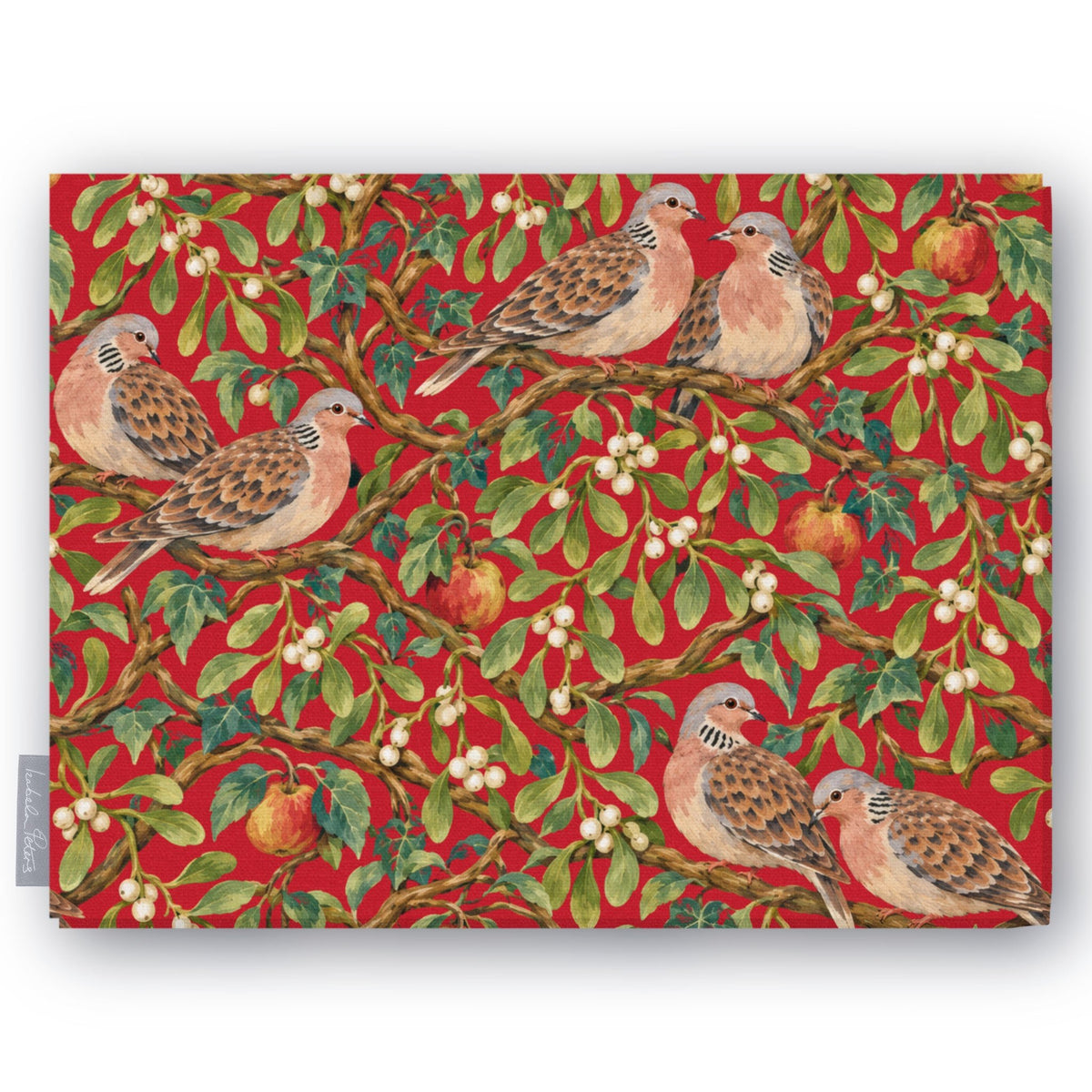 Red Turtle Doves and Mistletoe Christmas tablecloth folded on white, showing turtle doves among mistletoe and red apples