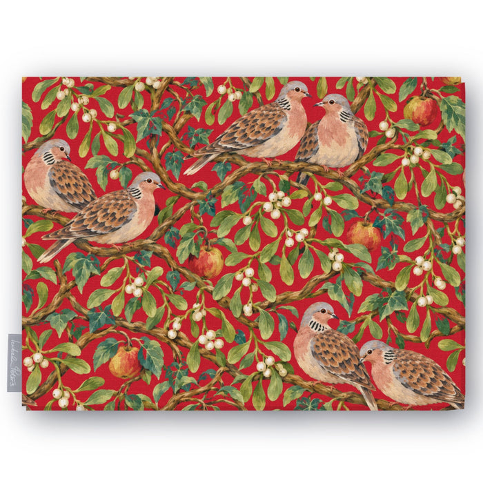 Red Turtle Doves and Mistletoe Christmas tablecloth folded on white, showing turtle doves among mistletoe and red apples