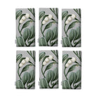 Mistletoe napkins in silver grey, set of six, folded on white, showing the same sprig of mistletoe with white berries