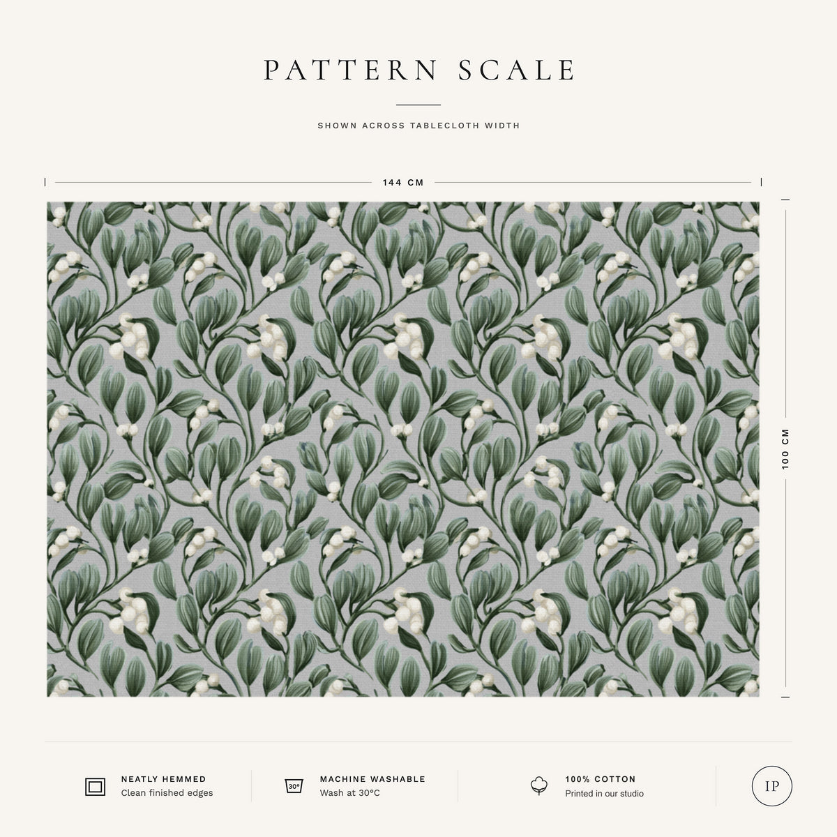 Pattern scale of the Mistletoe Christmas tablecloth in silver grey across its 144 cm width, with care notes