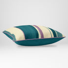 Angled view showing the front and Ink Blue plain reverse of an Unequal Stripe rectangular cushion in Ink Blue & Lilac, finished with Muted Lilac piping.