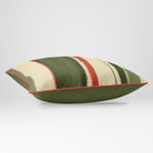 Angled view showing the front and Deep Olive plain reverse of an Unequal Stripe rectangular cushion in Olive & Tomato, finished with Tomato piping.