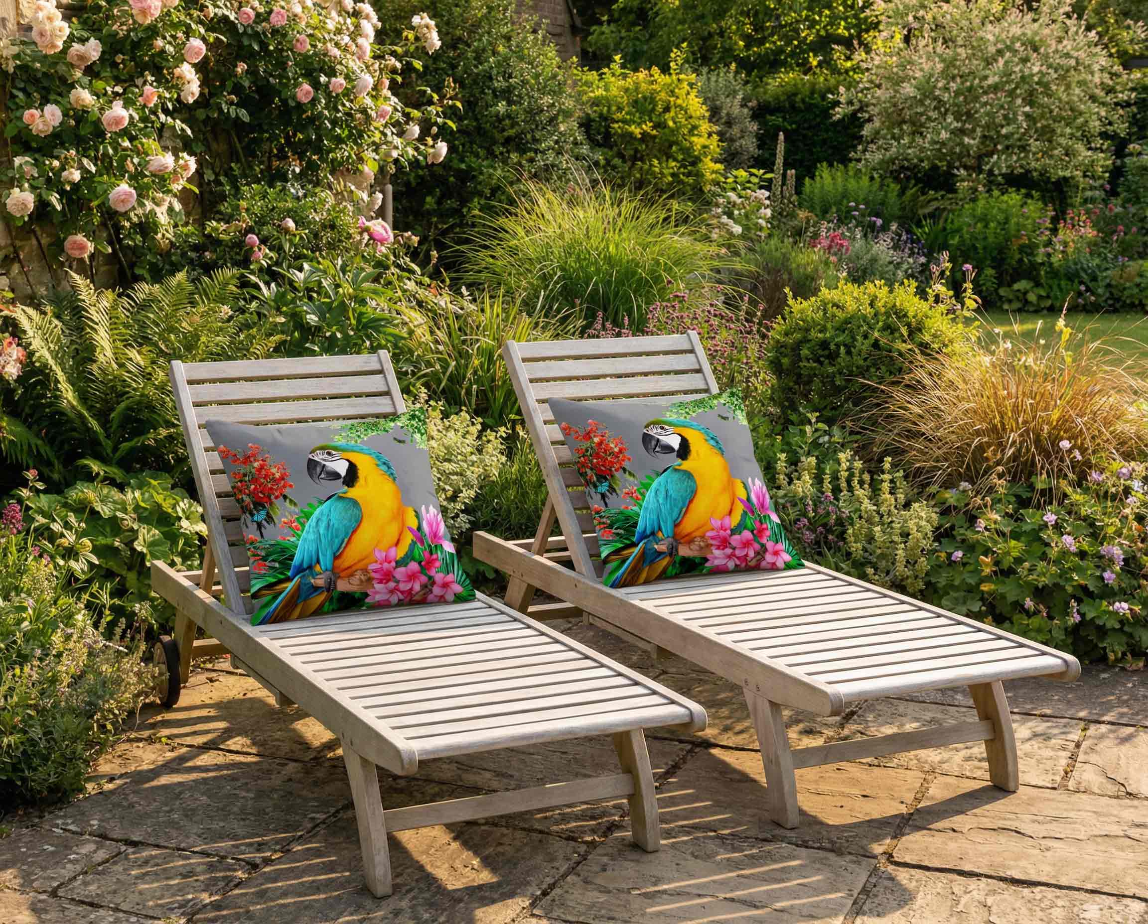 Outdoor parrot print cushions by Izabela Peters on wooden sun loungers in a British garden