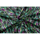 Floral Meadow velvet fabric in Violet On Shades Of Forest Green